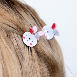 Set of two mini rabbit-shaped hair claw clips with white faces and pink ear details.