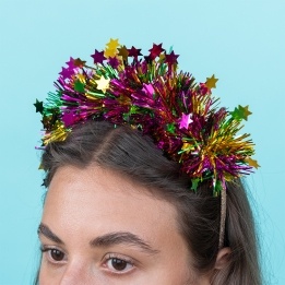 Christmas party headband with colourful tinsel and star.