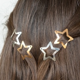 Gold and silver star hair clips in a set of four.