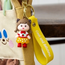 Strawberry girl bag charm with yellow polka dot skirt, silicone wrist strap and keyring