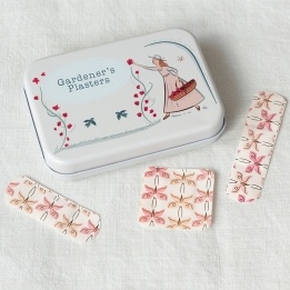 Gardener’s plasters in tin with butterfly-pattern plasters shown.