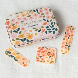 Floral plaster tin with matching flower-patterned plasters 