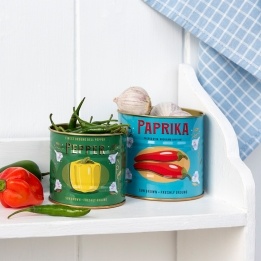 Decorative storage tins labelled "Pepper" and "Paprika" with illustrated peppers