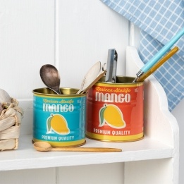 Decorative storage tins featuring vintage-style mango illustrations