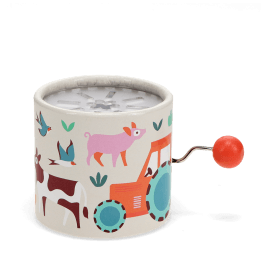 Farmyard‑themed winding music box with illustrated tractor and animals, featuring a red turning handle.