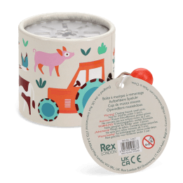 Farmyard‑themed winding music box with illustrated tractor and animals, featuring a red turning handle with tag.