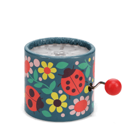 Winding music box with illustrated flowers and ladybird design, featuring a red turning handle.