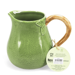 Green ceramic jug with textured surface and a curved brown handle with tag