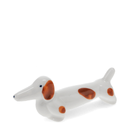 Ceramic sausage dog chopstick rest with brown patches 