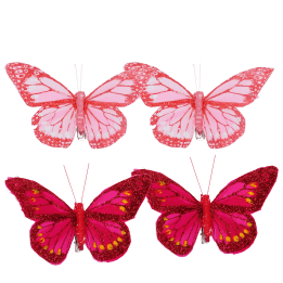 four butterfly clip decorations in light pink and dark pink,