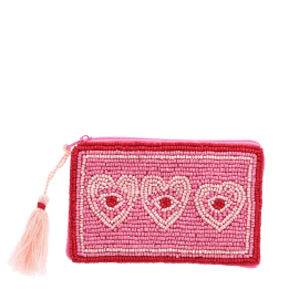Pink beaded purse with three heart designs and a pale pink tassel.