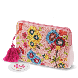 Pink beaded makeup bag with colourful floral designs and a bright pink tassel.