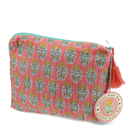 Pink quilted wash bag with orange and green flowers design and a tag.