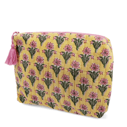 Yellow quilted wash bag with a pink and green flowers design.