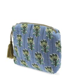Blue quilted makeup bag with green and blue flowers.
