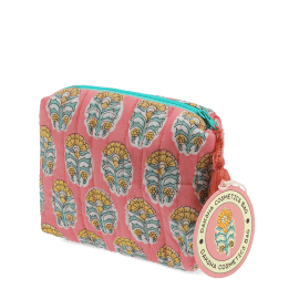 Pink quilted wash bag with orange and green flowers design and a tag.
