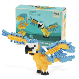 Completed macaw brick model displayed beside its packaging box.