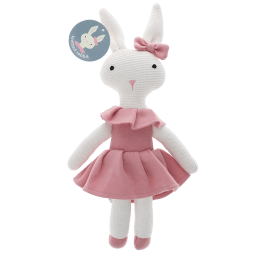 Knitted rabbit toy with long ears, wearing a pink dress with a ruffled collar and a matching bow on one ear