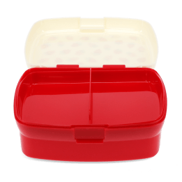 Open red lunch box with a cream lid and two interior compartments tray.