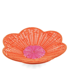 A shallow orange woven plastic basket with a flower-shaped rim and a pink centre.