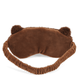 Brown plush teddy bear–shaped travel eye mask with embroidered facial features.