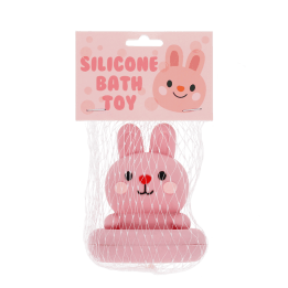 Pink silicone bunny bath toy with upright ears and simple face, in a packaging