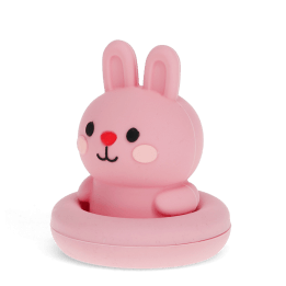 Pink silicone bunny bath toy with upright ears and simple face, in round base