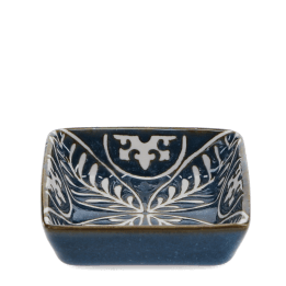 Blue ceramic square dish with white floral pattern interior