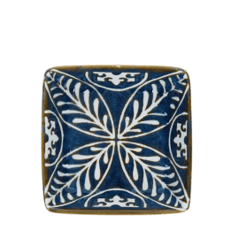 Blue ceramic square dish with white floral pattern interior