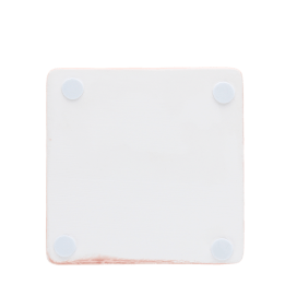 Back of pink ceramic coaster with four corner foam pads to prevent surface scratches.