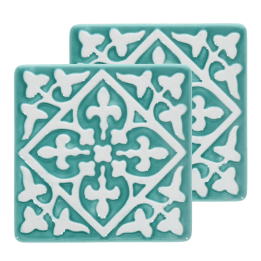 Set of two turquoise ceramic coaster with embossed pattern.