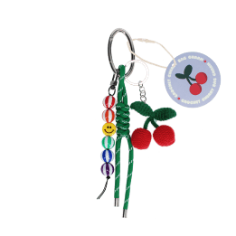 Crochet cherry bag charm with green cord strap, colourful beads and tag.