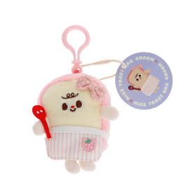 Plush toast bag charm with pink clip, pink spotty bow with tag.