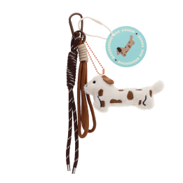 Plush sausage dog bag charm with brown spots, cord strap and metal clip with tag.