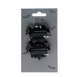 Set of two black bat-shaped hair claw clips on Halloween-themed retail packaging.