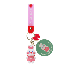Bunny bag charm with pink outfit, silicone wrist strap and bow detail with tag.