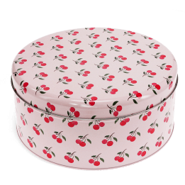 Round cake tin featuring a vintage-style apple pattern