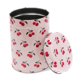 Pink canister tin with open lid, decorated with red cherry pattern