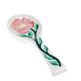 White ceramic spoon rest with blue fish design.