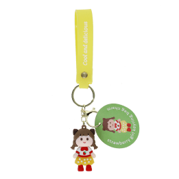 Strawberry girl bag charm with yellow polka dot skirt, silicone wrist strap and keyring with tag.