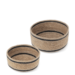 Set of two round woven storage baskets with black stripe detail.