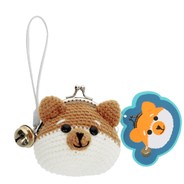 Crochet fox-shaped coin purse with a metal clasp and hanging bell charm with tag.