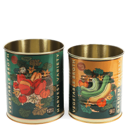 Set of two vegetable broth storage tins with colourful harvest vegetable illustrations