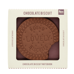 Chocolate biscuit-shaped notebook with bite-mark detail, displayed in retail packaging.