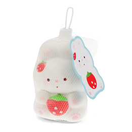 White bunny squishy toy holding a strawberry, packaged in mesh netting with hanging tag.
