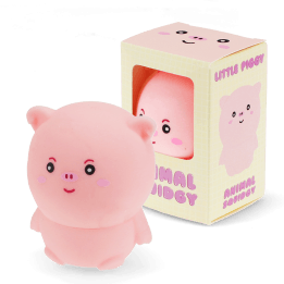 Pink pig-shaped squishy toy with smiling face, shown beside matching display box.