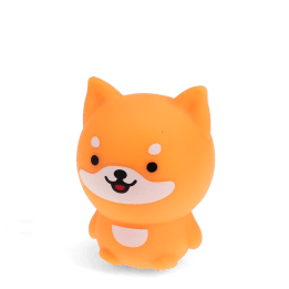 Orange dog-shaped squishy toy with smiling face and soft rounded design
