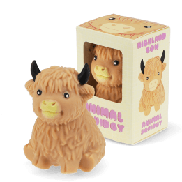 Highland cow squishy toy with textured fur and black horns, shown beside matching display box.