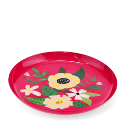 Round pink metal trinket tray with colourful floral design.