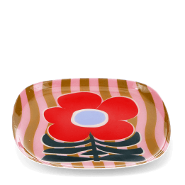 Square metal trinket tray with bold red flower design on a pink striped background.